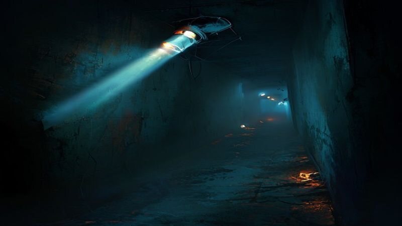 A flashlight beam cutting through a dark corridor